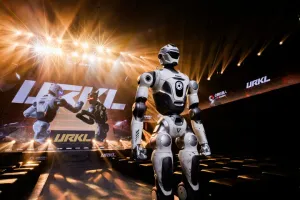 URKL T800 robot standing before an empty arena bathed in stage lighting