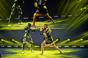 URKL T800 robot sparring with a Muay Thai fighter on stage