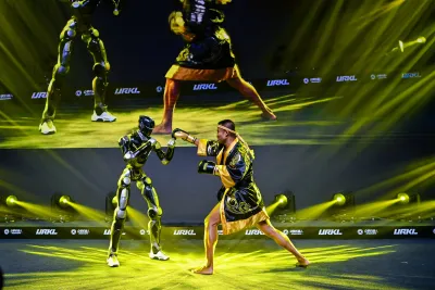 URKL T800 robot sparring with a Muay Thai fighter on stage